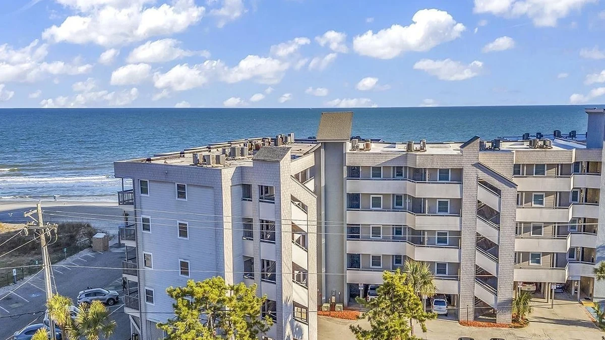A coastal condominium building near the beach